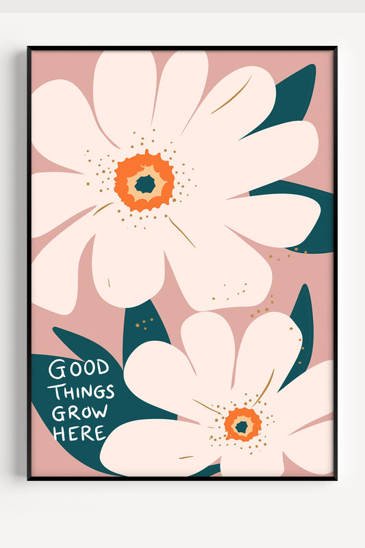 Good Things Grow Here nursery poster with pink floral design displayed in a black frame.